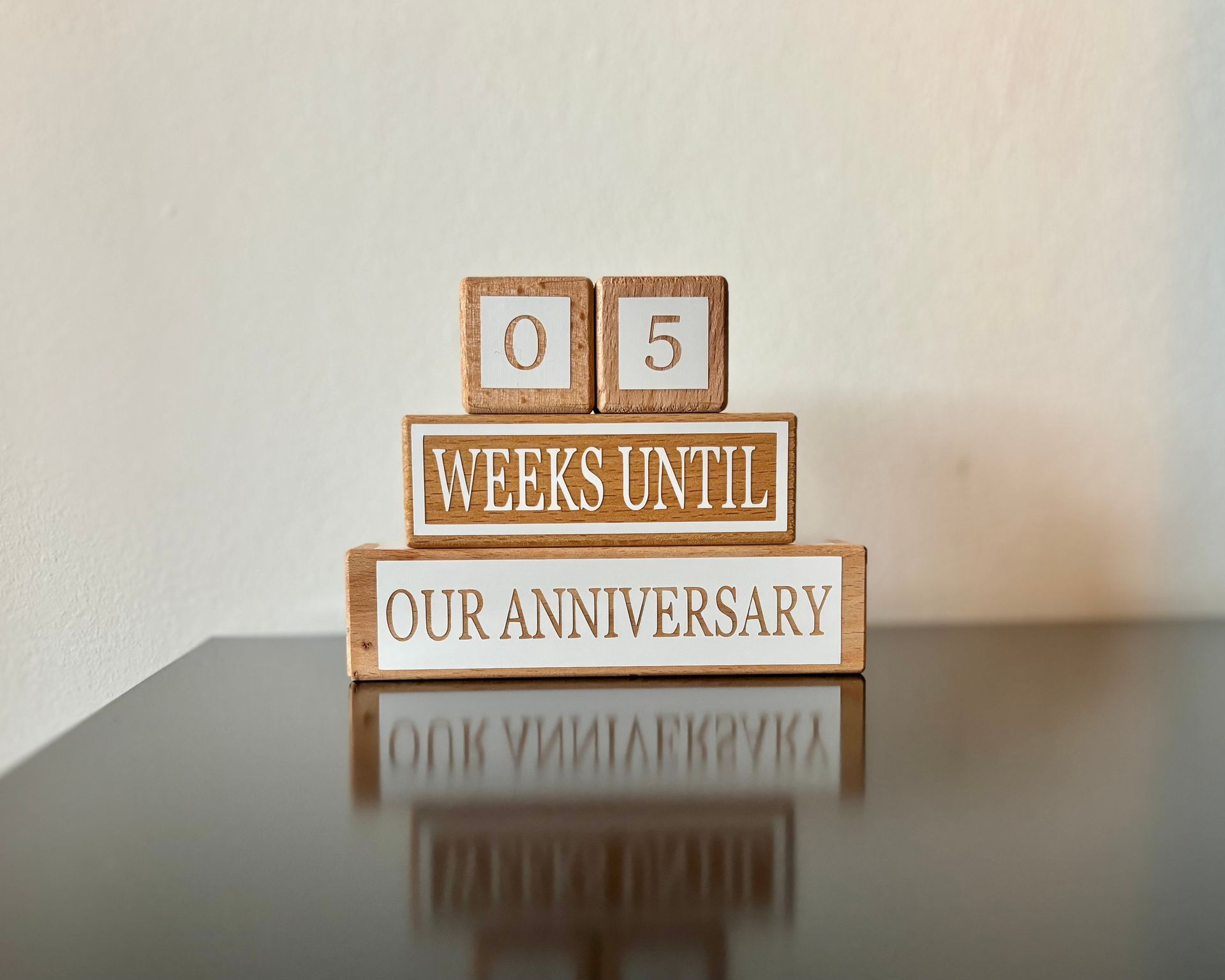 A decorative block sign counts down 