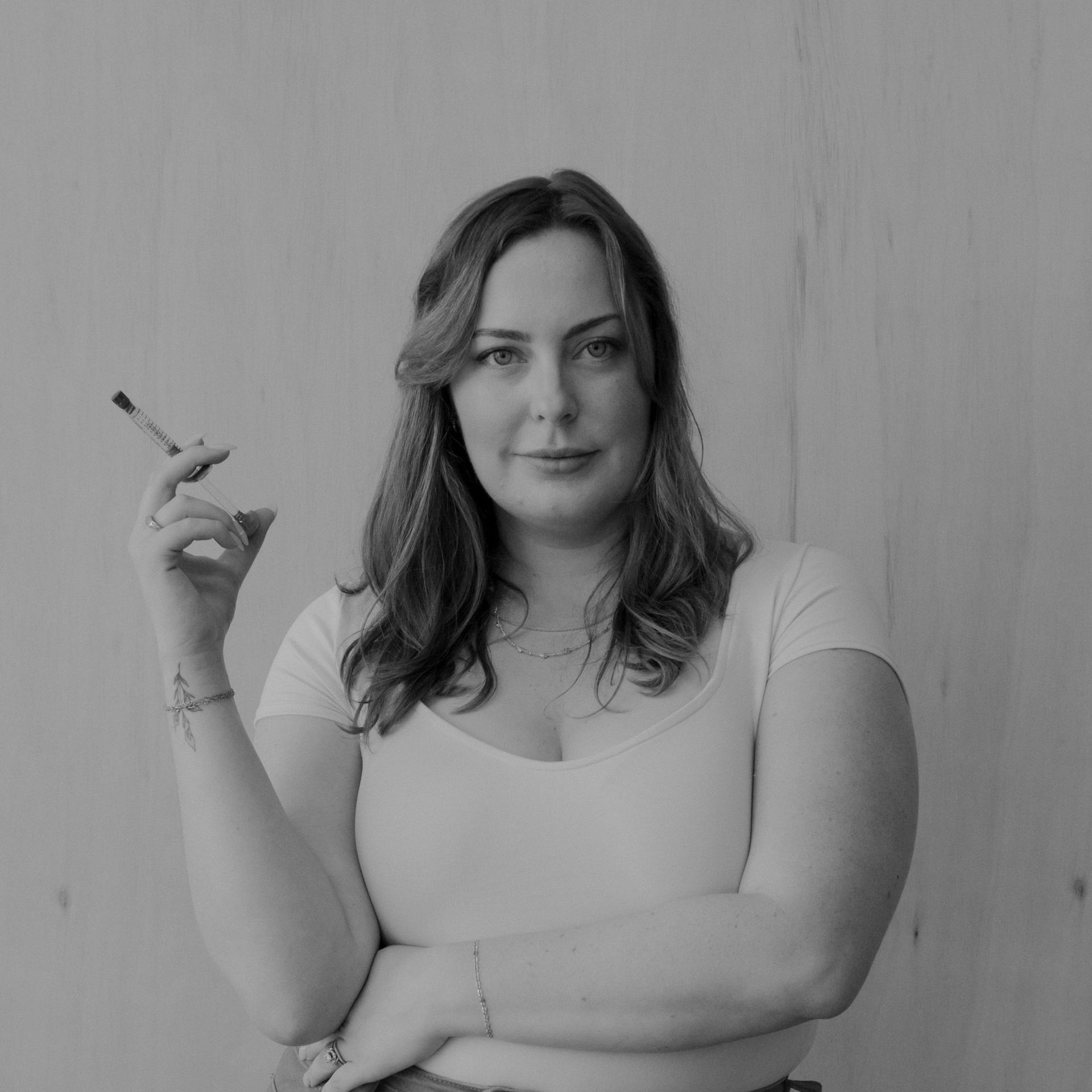 A woman is getting her face examined by a doctor.