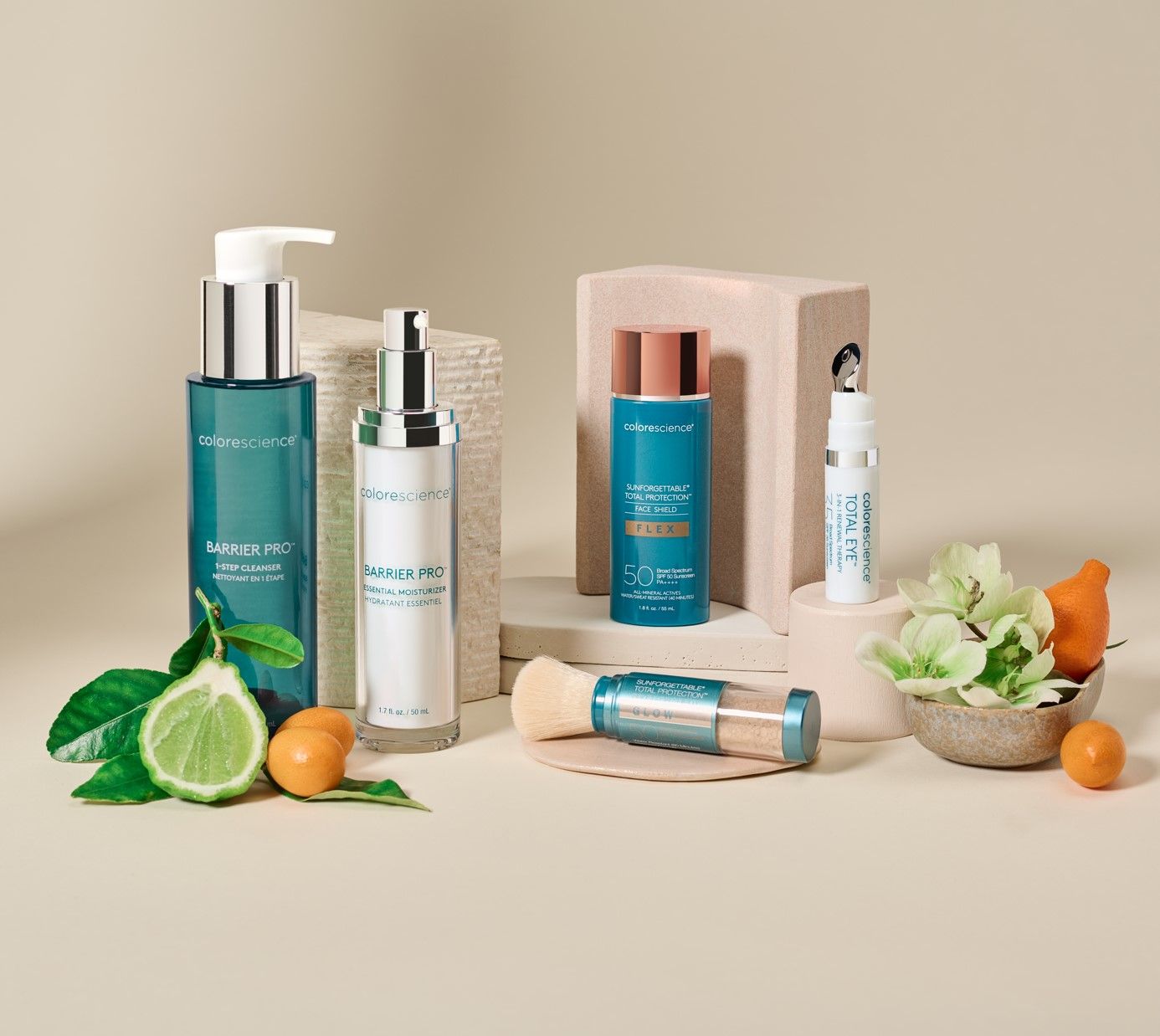 A table topped with bottles of cosmetics and fruit.