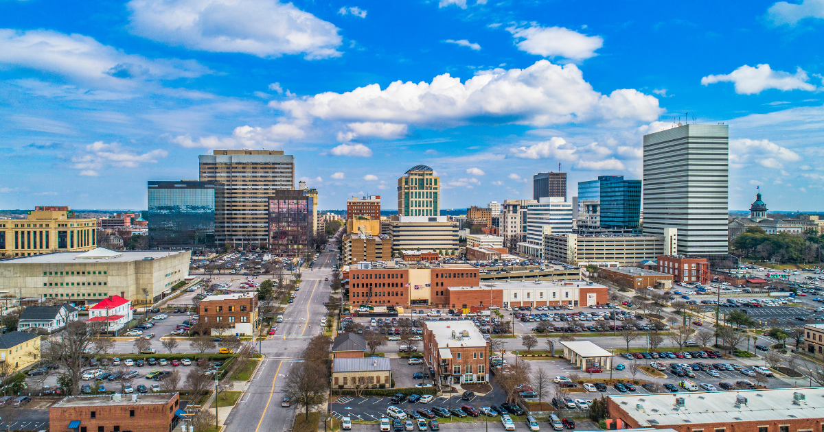 A modern house with a swimming pool and a lot of windows.