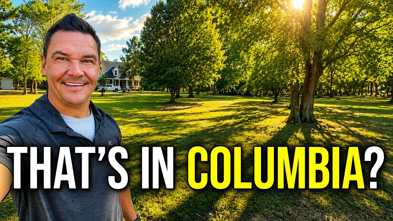 Smiling man in a sunny park with bold text: “THAT’S IN COLUMBIA?”
