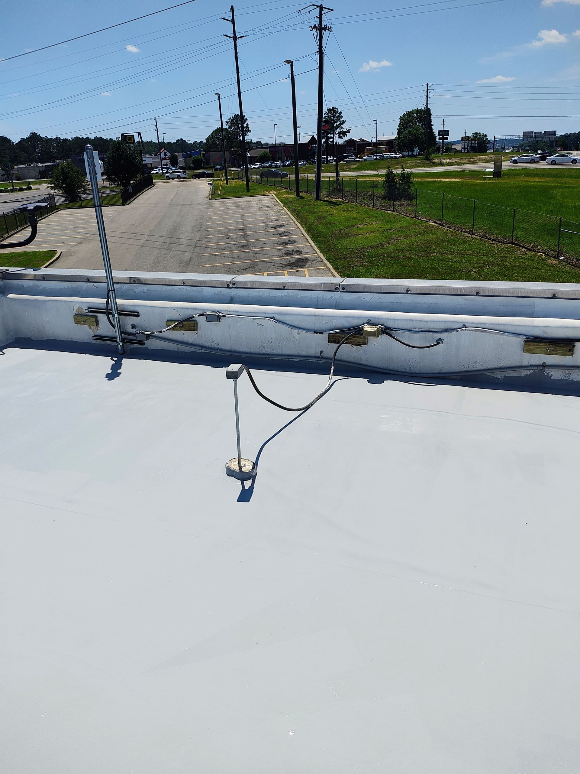 A white roof with a rope attached to it.