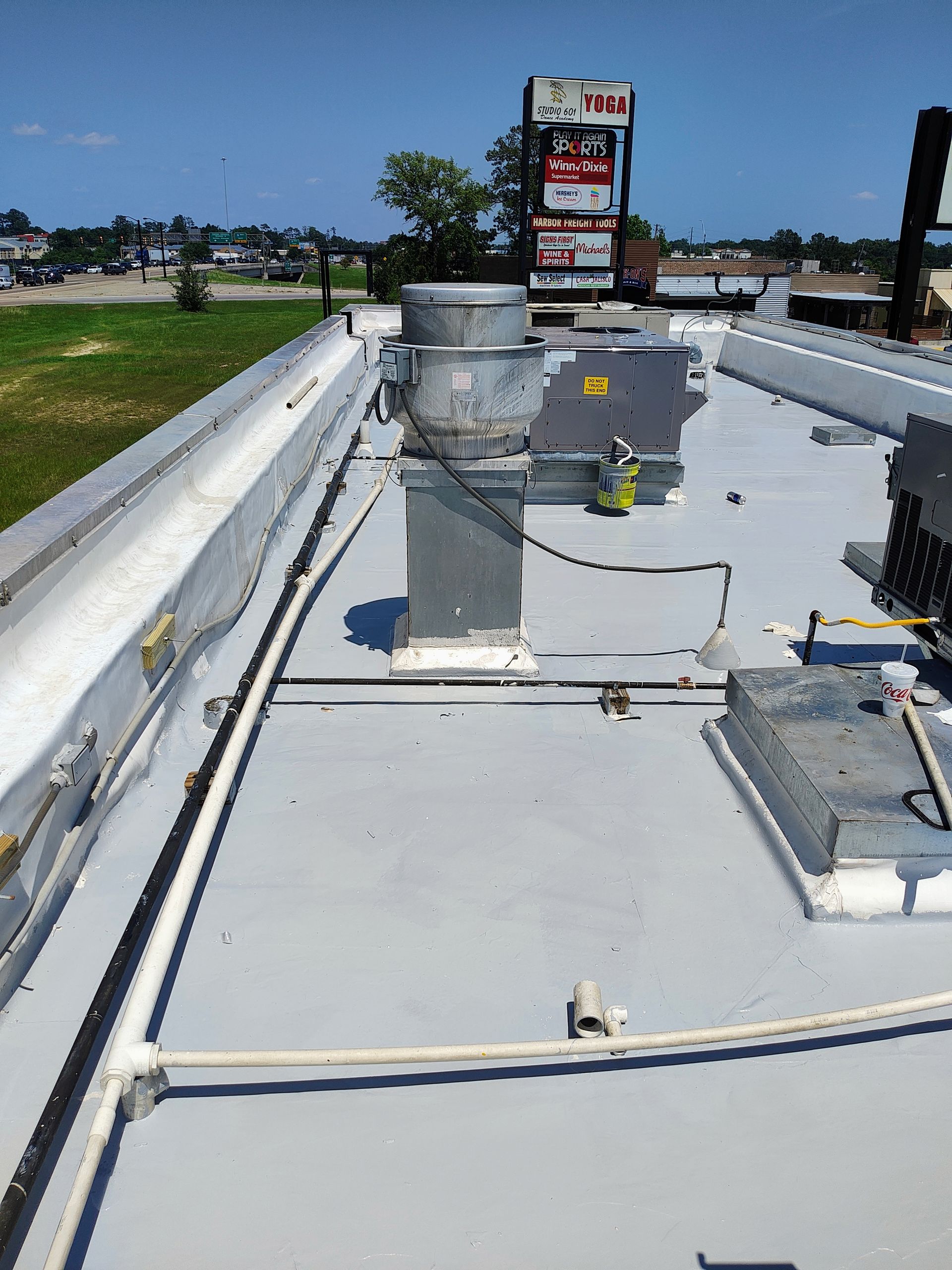 The roof of a building with a sign on top of it.