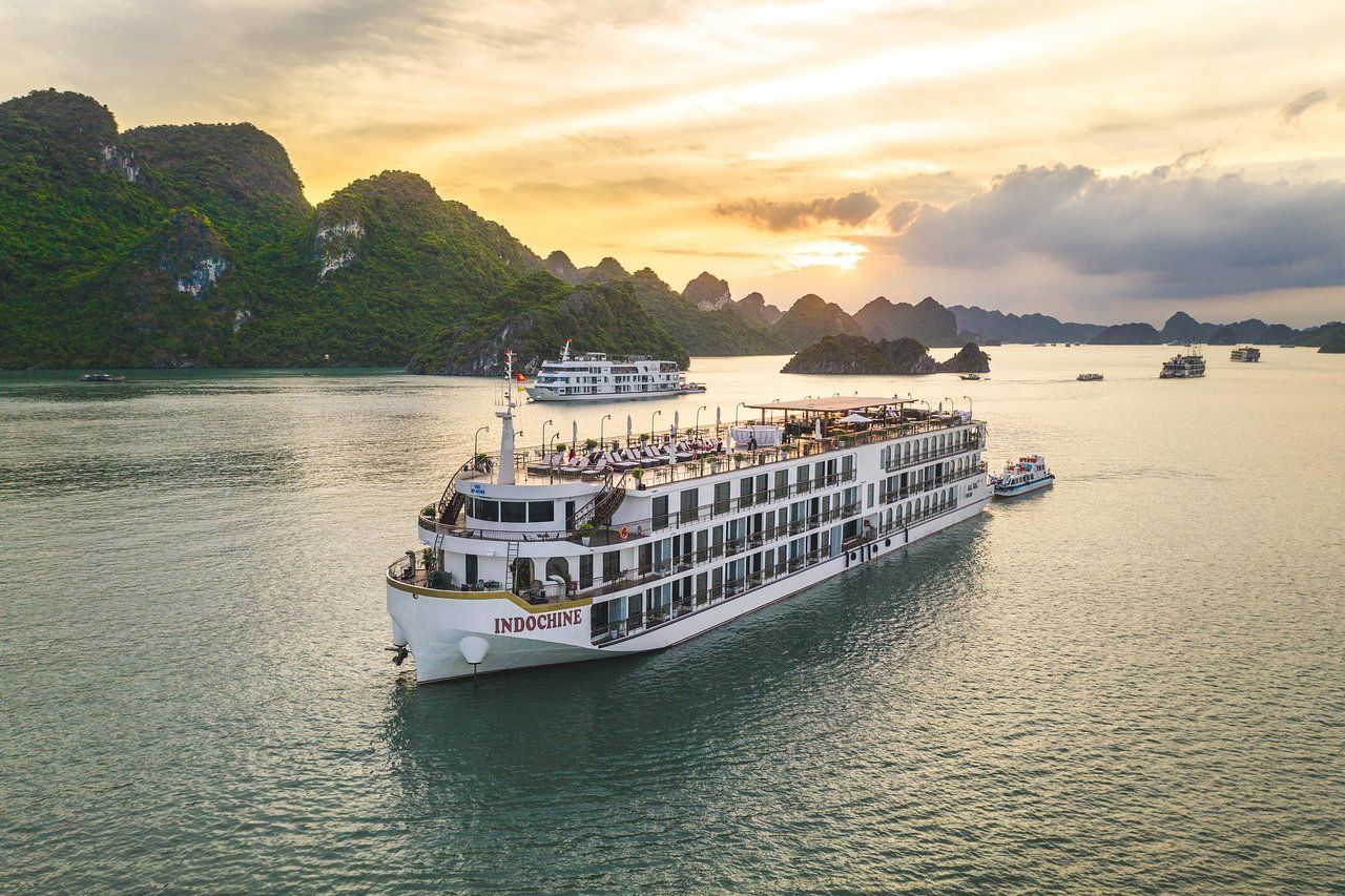 A large cruise ship is floating on top of a body of water.