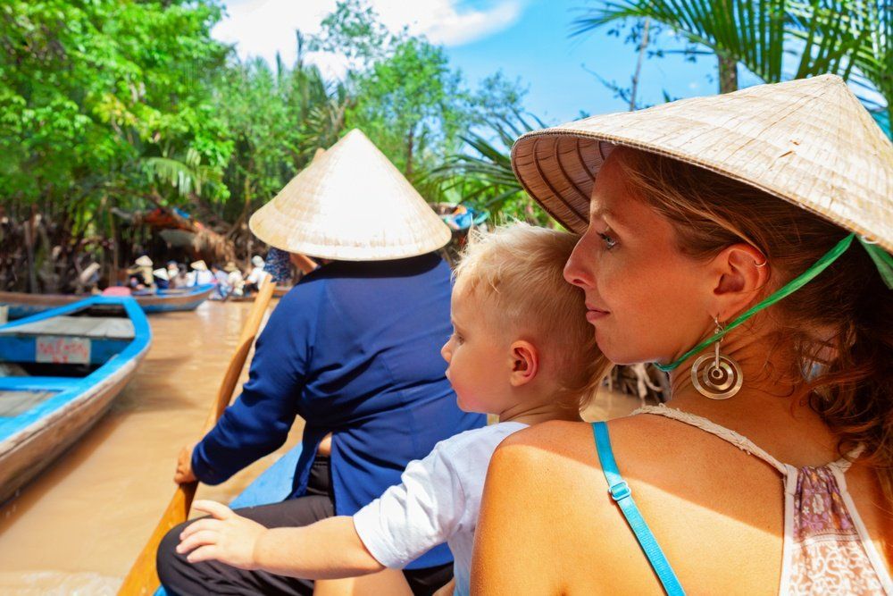 A woman and a child are sitting in a boat.