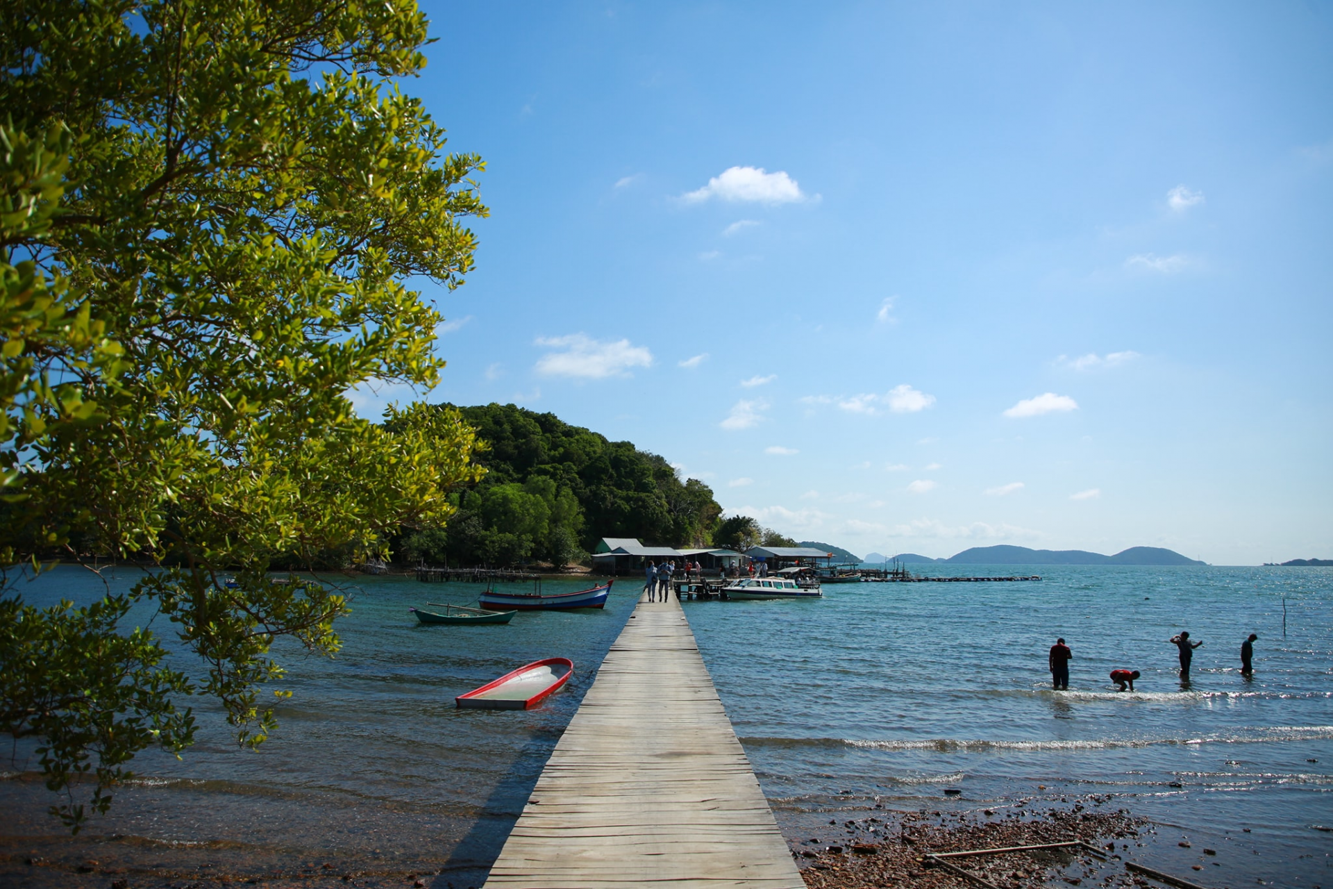A wooden dock leading to a body of water