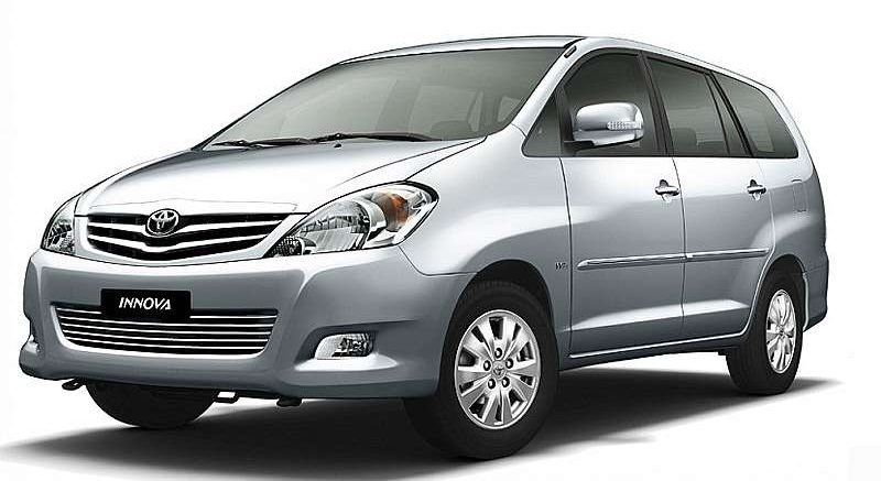 A silver minivan is shown on a white background