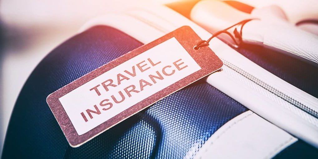 A suitcase with a tag that says `` travel insurance '' on it.