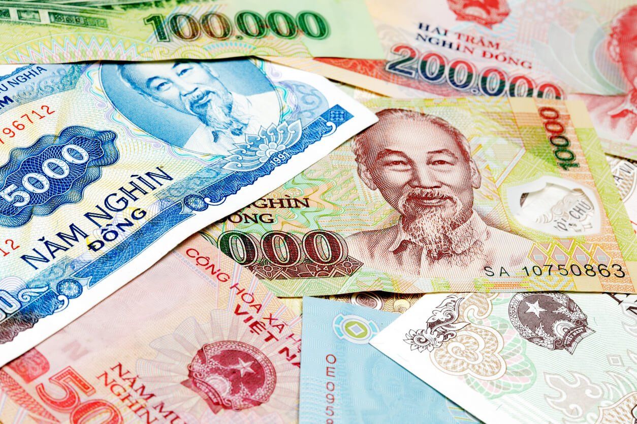 A bunch of money is laying on top of each other.