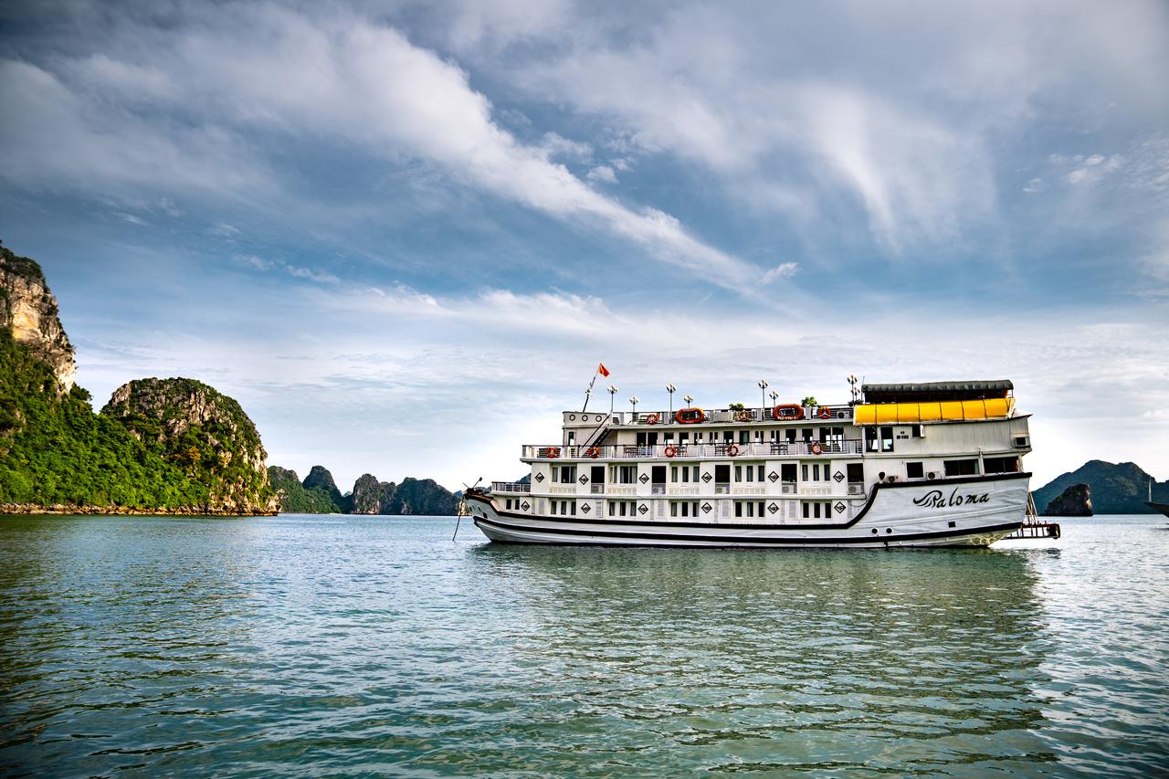 A large cruise ship is floating on top of a body of water.