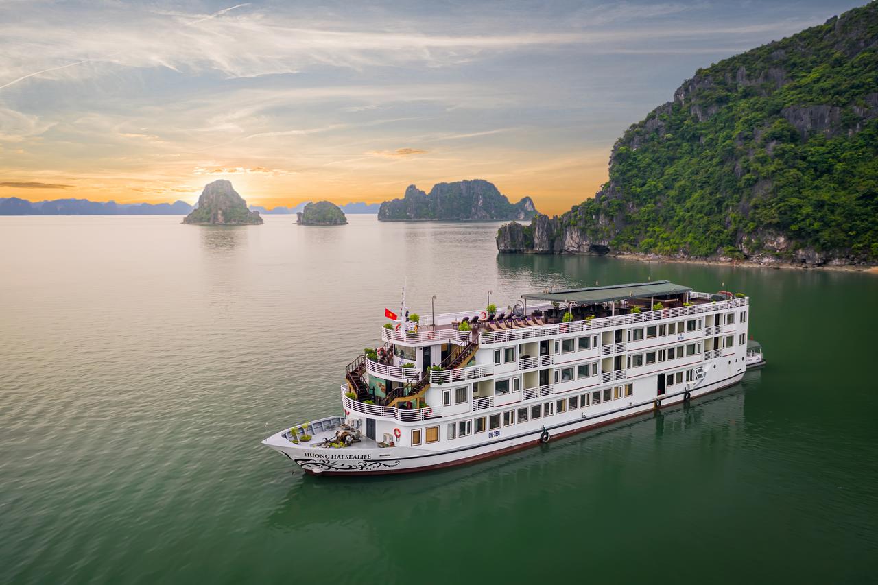 A large cruise ship is floating on top of a body of water.