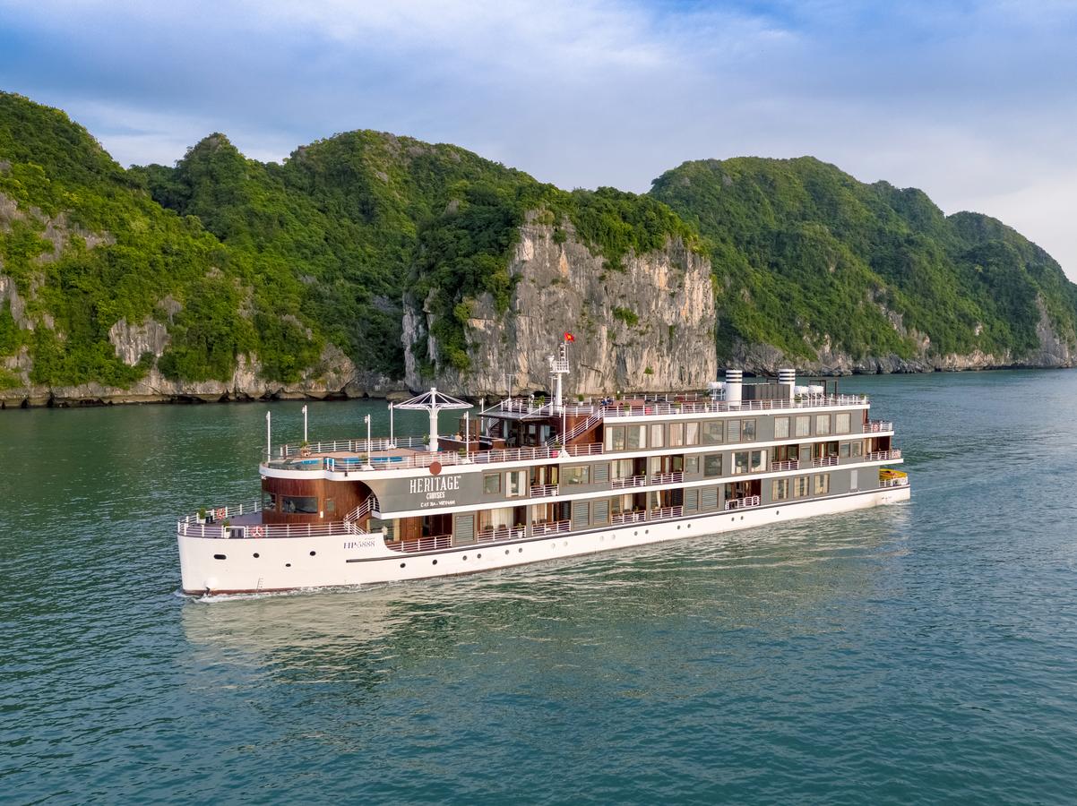 A large cruise ship is floating on top of a body of water.