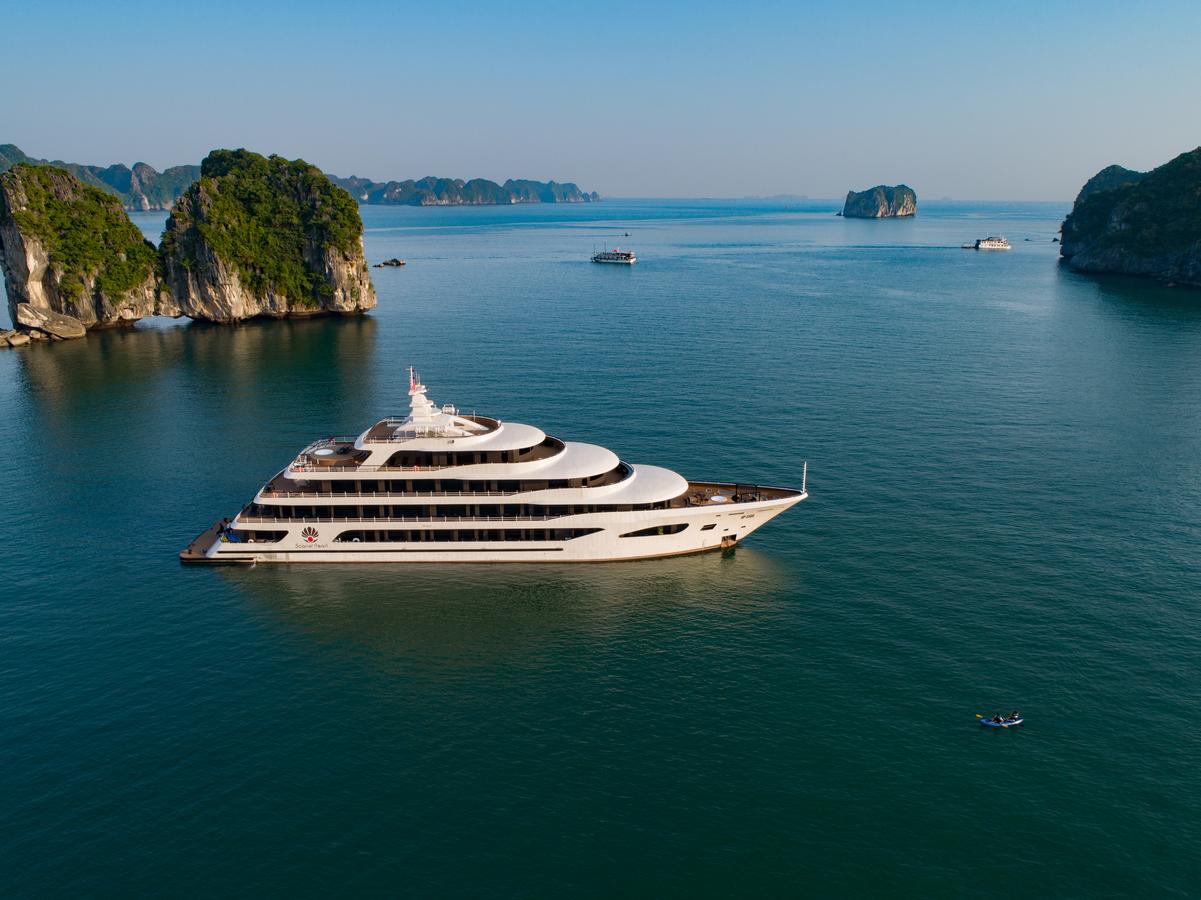 An aerial view of a large yacht floating on top of a body of water.