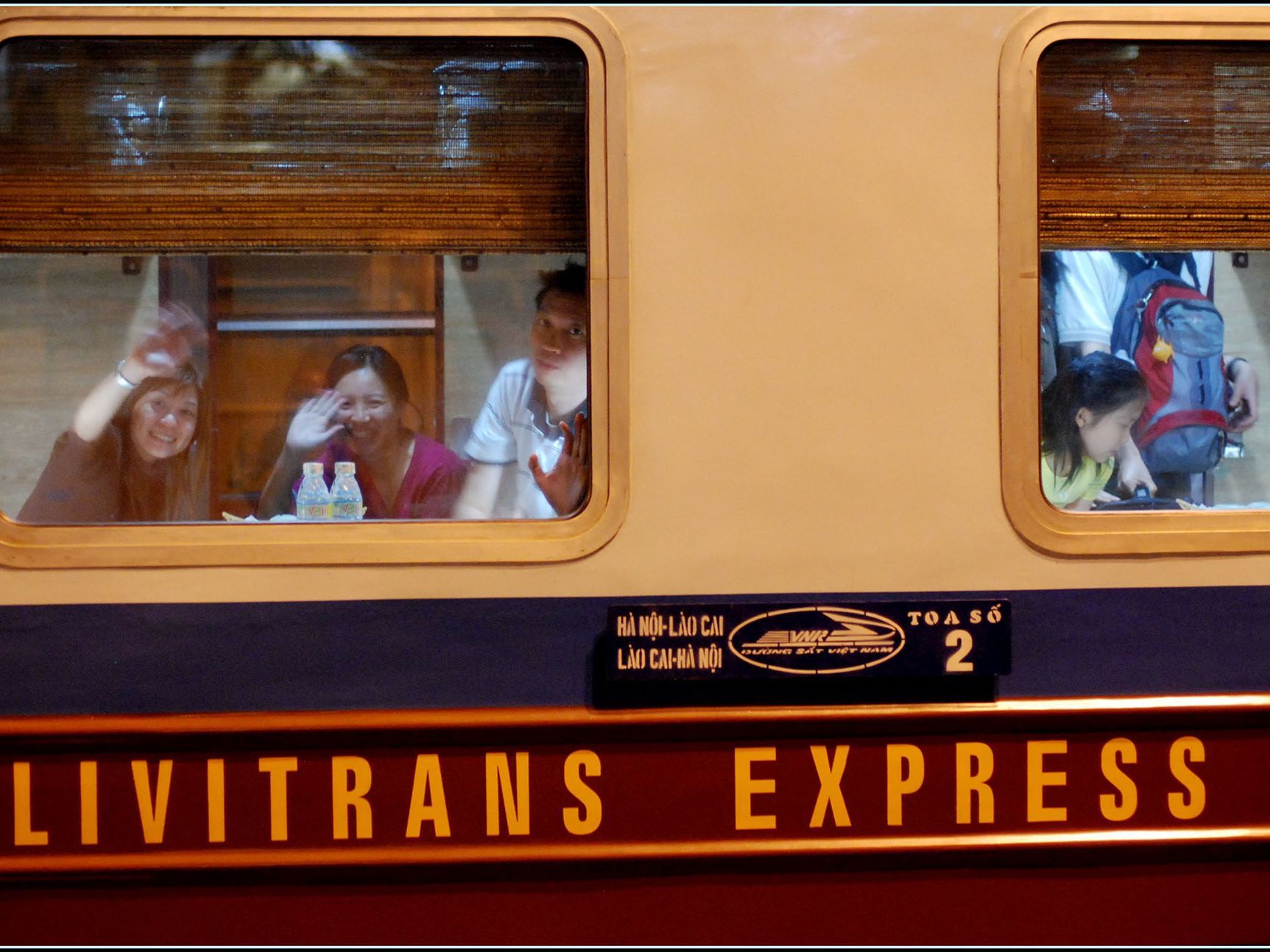 A group of people on a livitrans express train