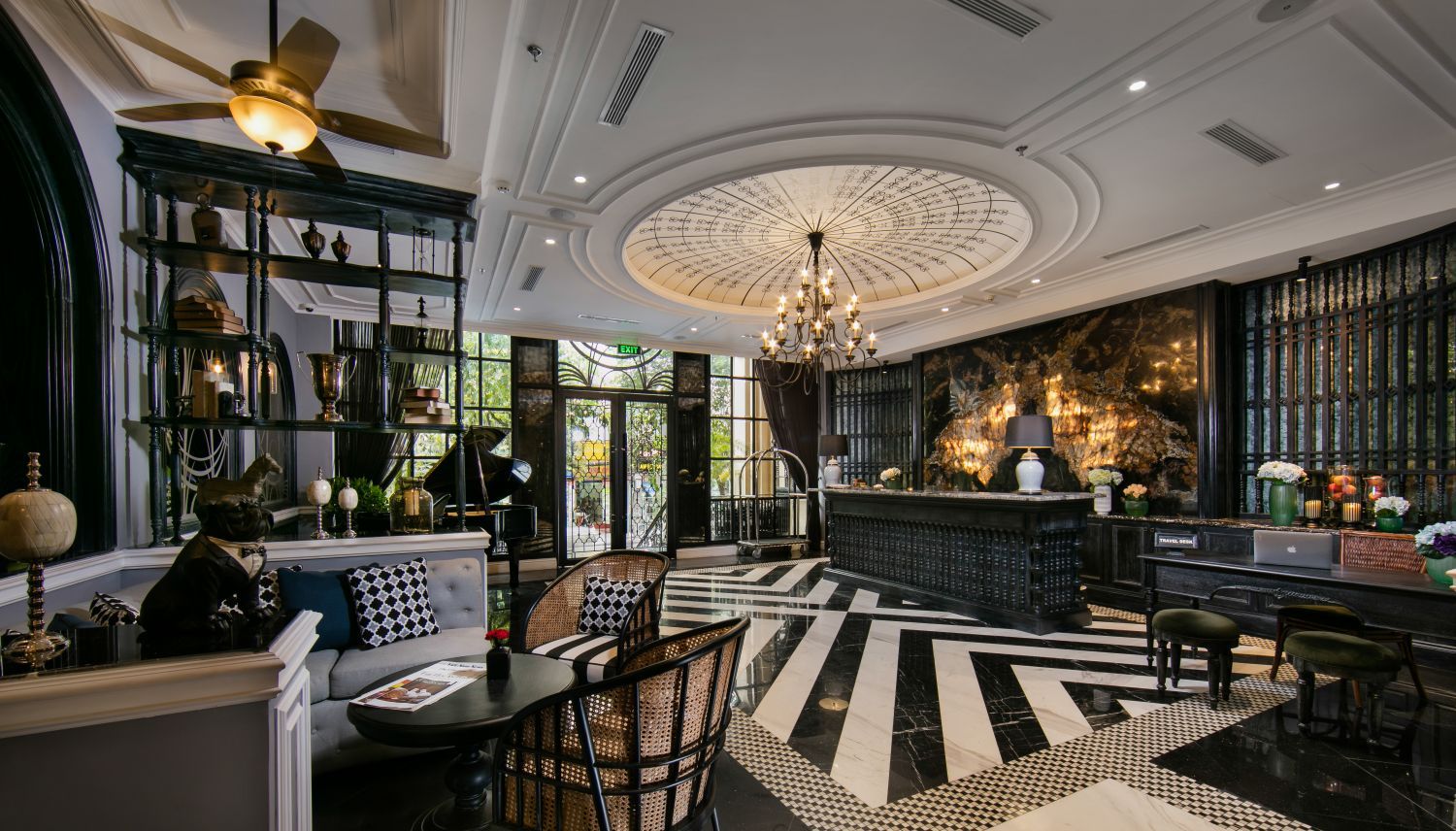 A large room with a ceiling fan and a striped floor.
