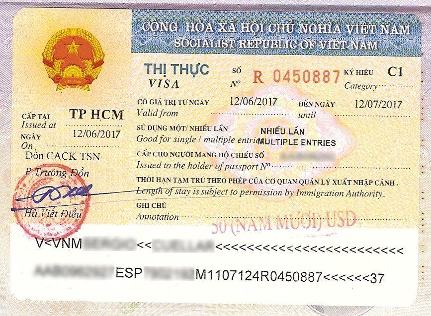 A close up of a vietnamese visa with a stamp on it