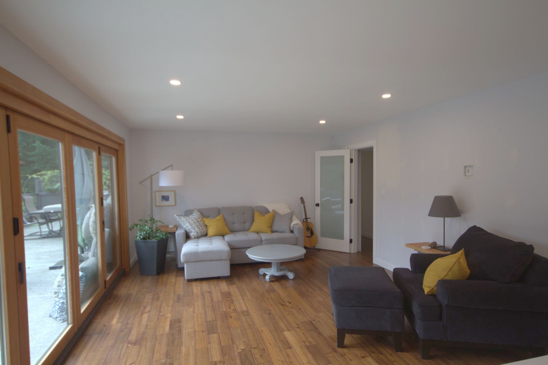 A living room with a couch , chair and table