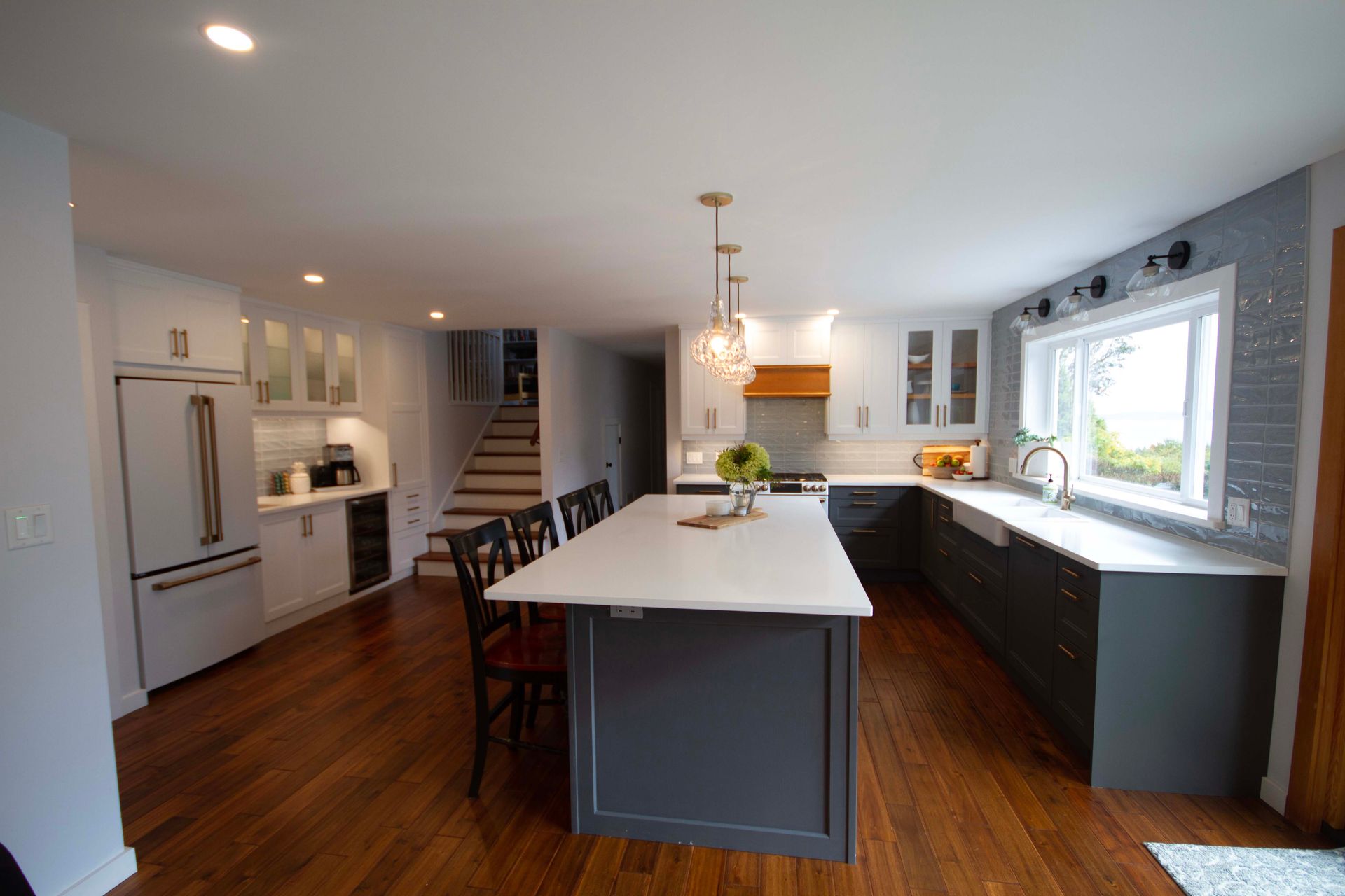 A kitchen with a large island in the middle of the room.