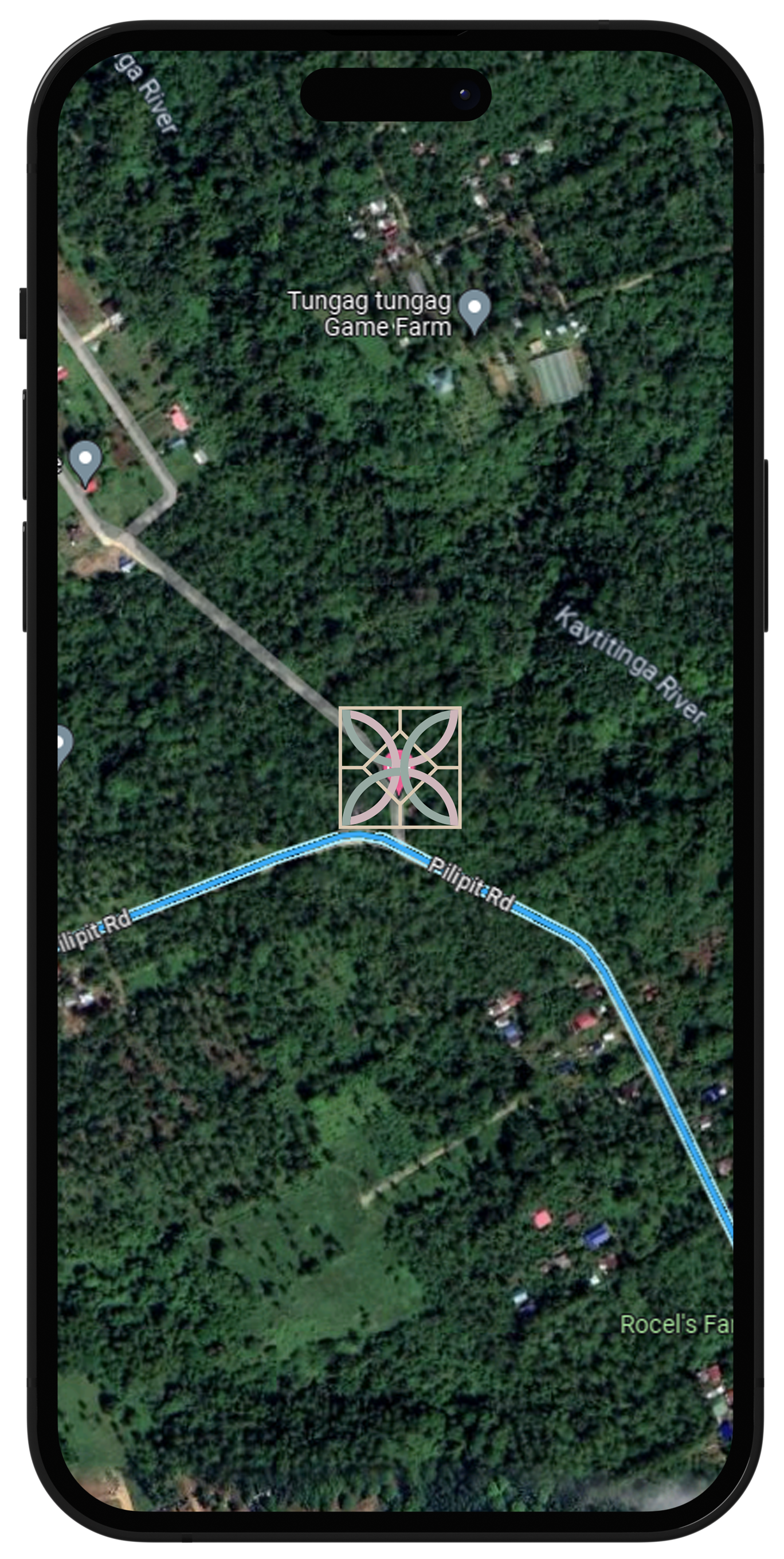 An aerial view of a house with a pool on a cell phone.