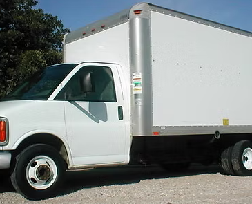 White box truck parked on a gravel surface, ready for moving.