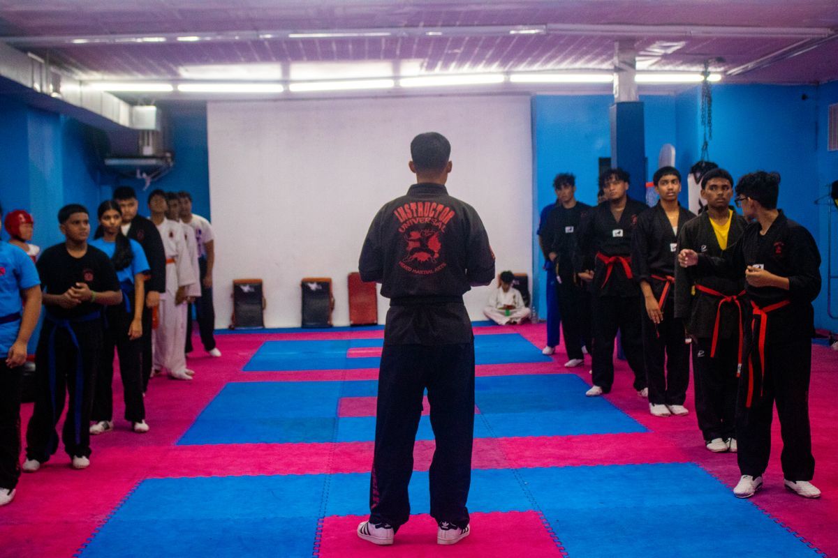 Students training striking and grappling at Universal Mixed Martial Arts in South Richmond Hill, NY for fitness and confidence