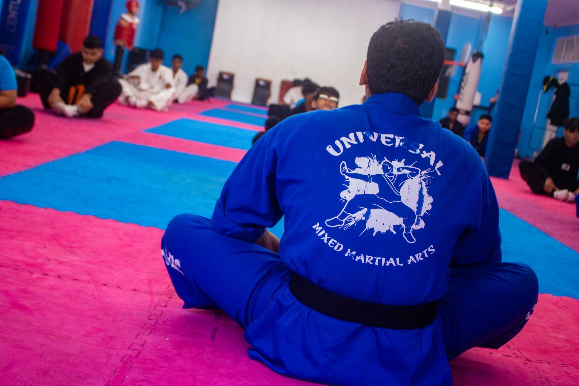 Students drilling Mixed Martial Arts techniques at Universal Mixed Martial Arts in South Richmond Hill, NY for fitness and focus.