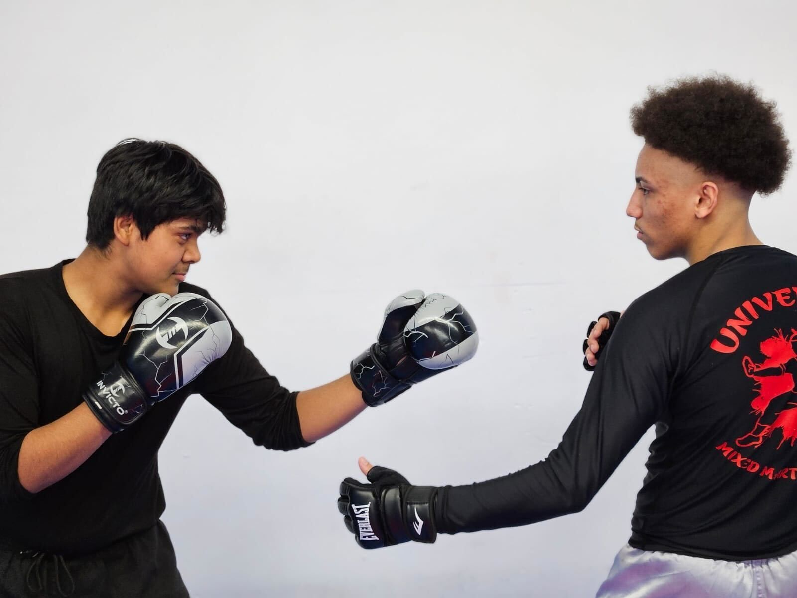 Students training mobility-focused Mixed Martial Arts at Universal Mixed Martial Arts.