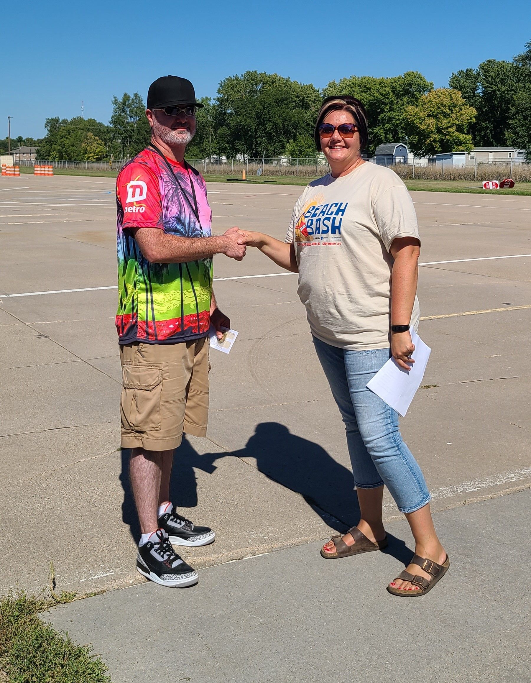 Photo of Joe Walker, Metro Transit Omaha, second place body on chassis division with NATP President Nikki Pinkelman