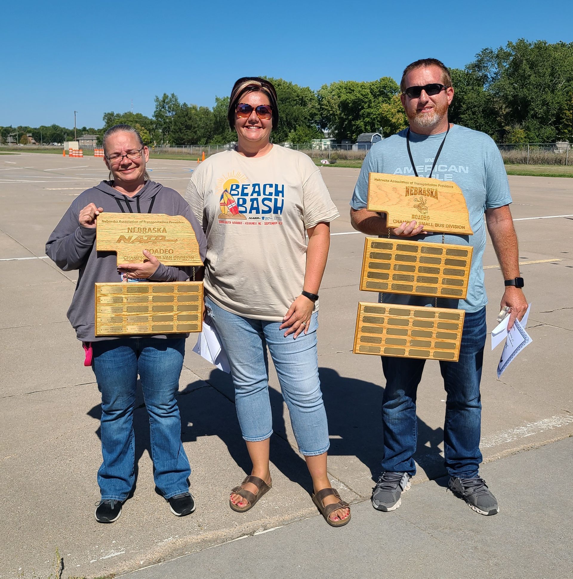 Photo of the first-place winners with the traveling trophy that they took home to be displayed at their agency until next year’s Roadeo.