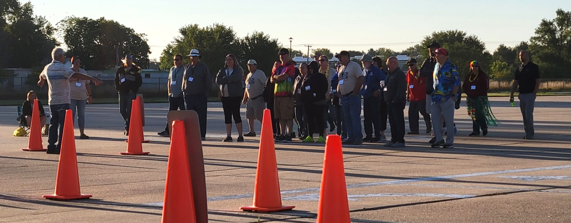 Photo of 2023 NATP Roadeo participants doing a walk-through of the driving course