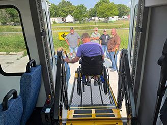 photo of drivers learning how to properly use a wheelchair ramp on a bus