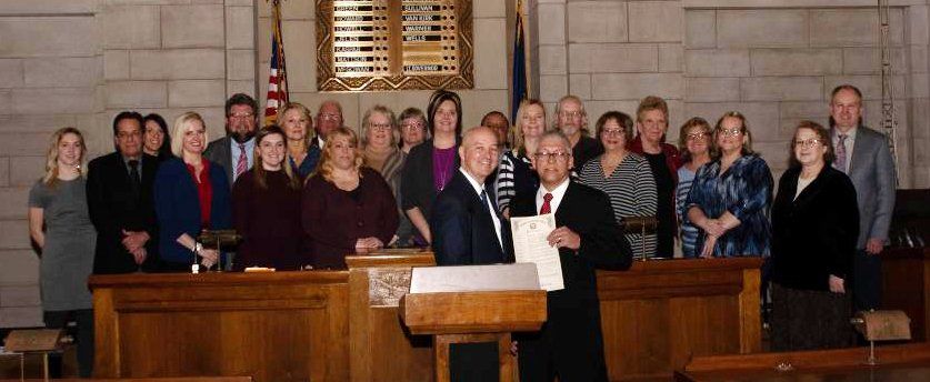photo of transit managers with Nebraska Governor Pete Ricketts after he signed the 2019 Nebraska Public Transit Week proclamation