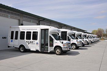 photo of RYDE Transit shuttle buses lined up in front of the bus barn