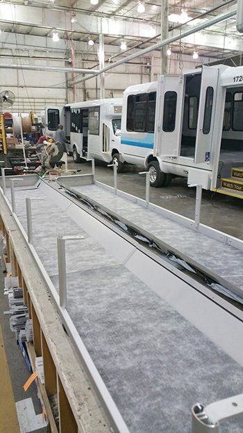 photo of vehicles on an assembly line