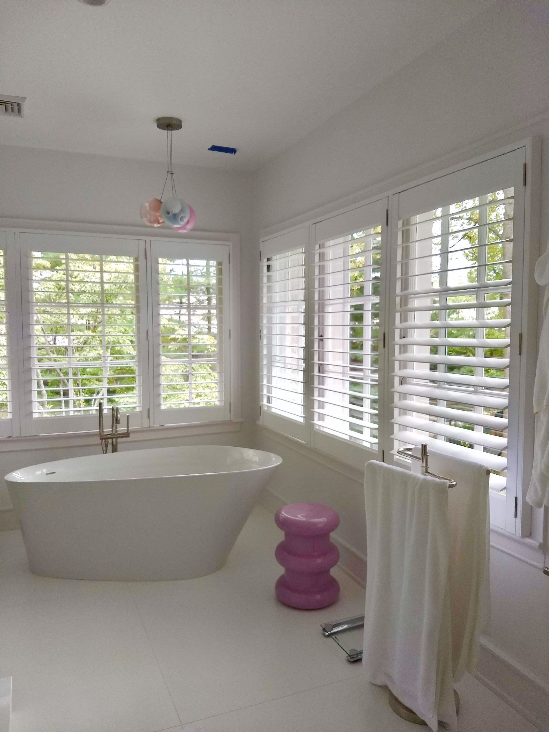 white shutters for privacy in bathtub