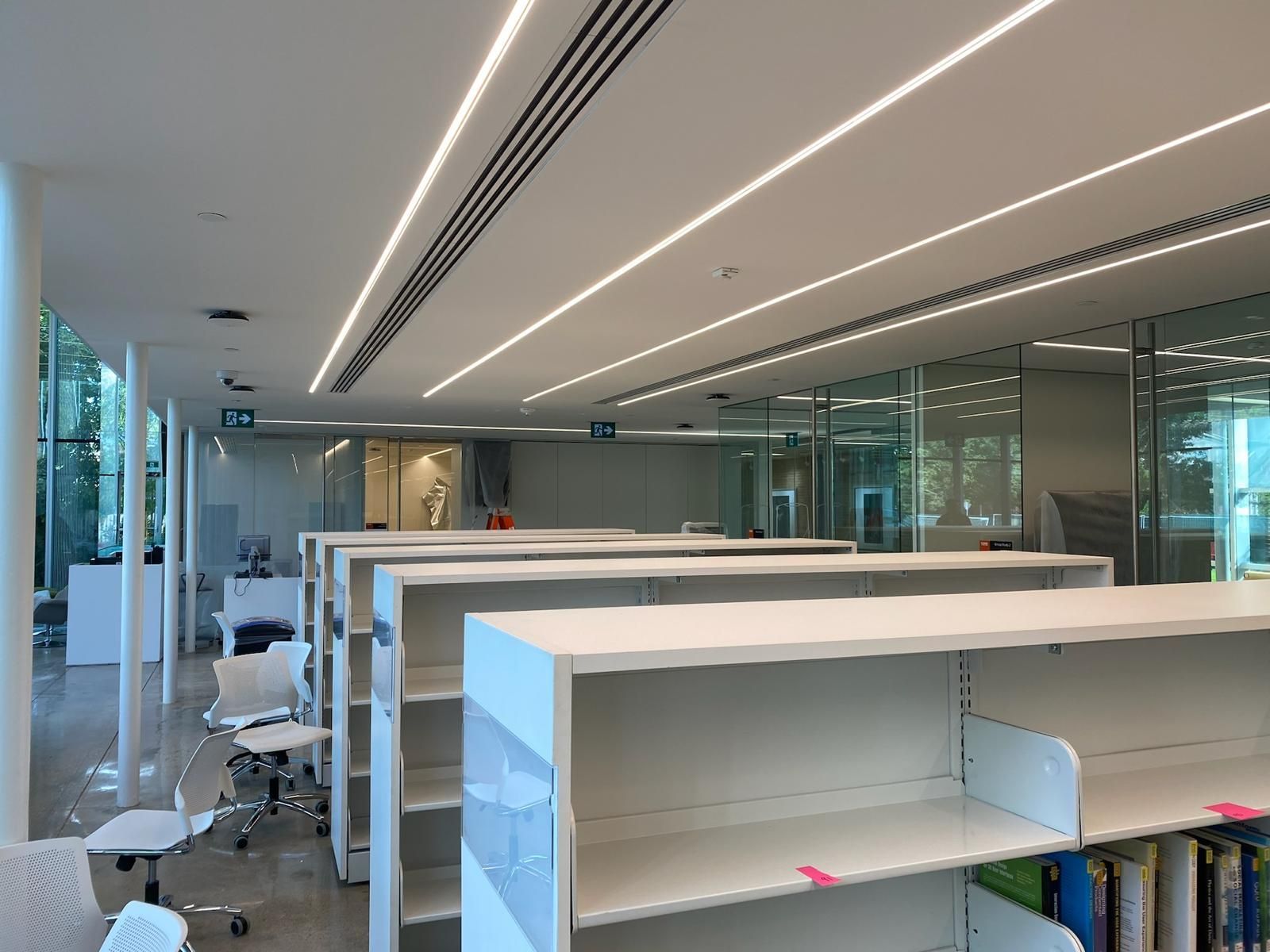 A library with a lot of shelves and chairs