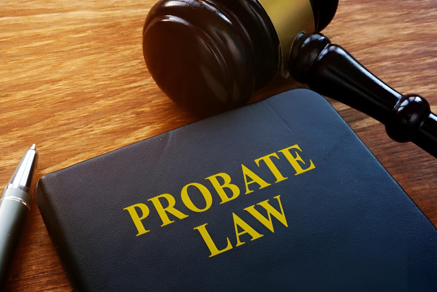 A Book Titled Probate Law is Sitting on a Wooden Table Next to a Judge's Gavel — Bradley J Bragg - Solicitor in Atherton, QLD