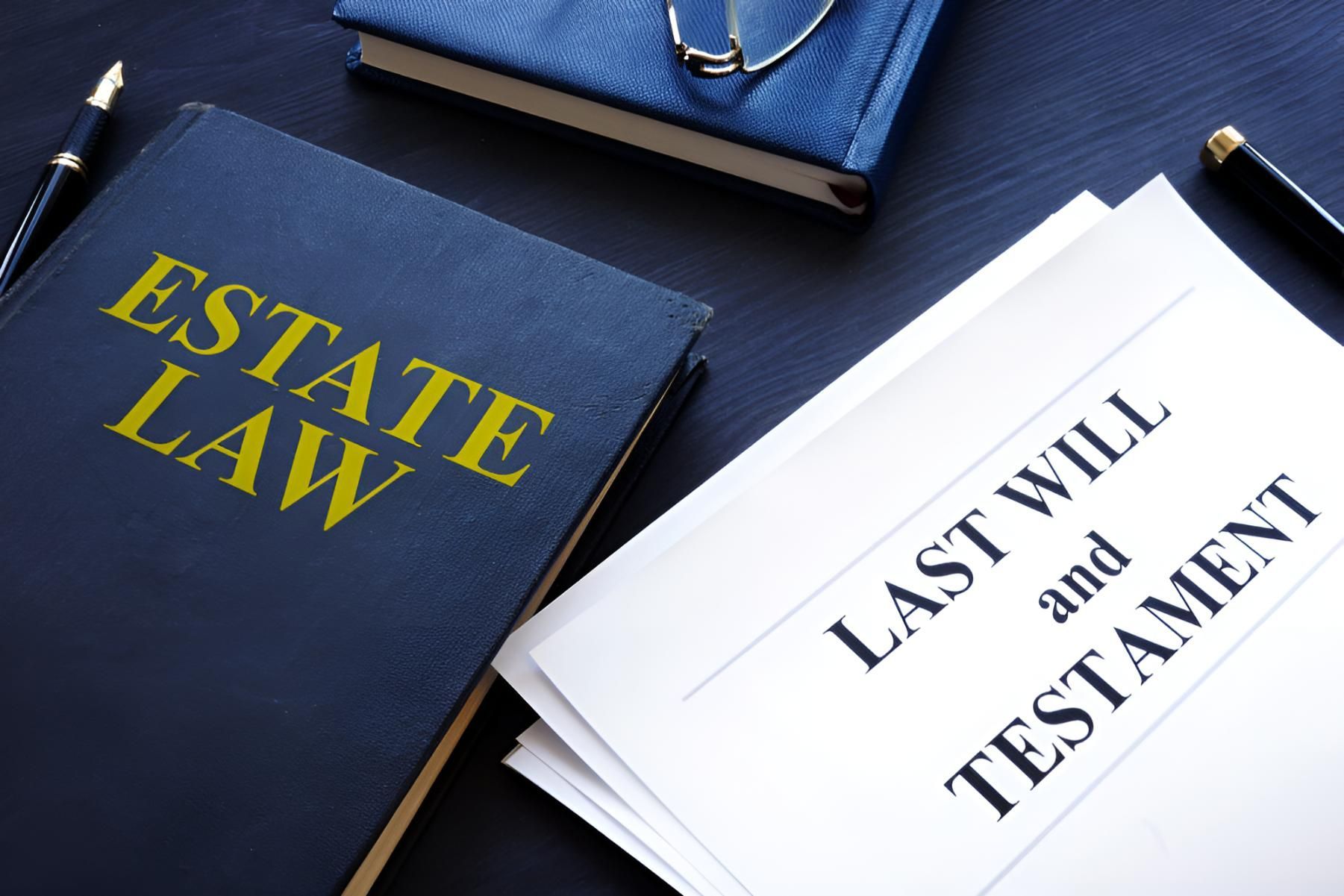 A Book Titled Estate Law Next to a Last Will and Testament — Bradley J Bragg - Solicitor in Atherton, QLD