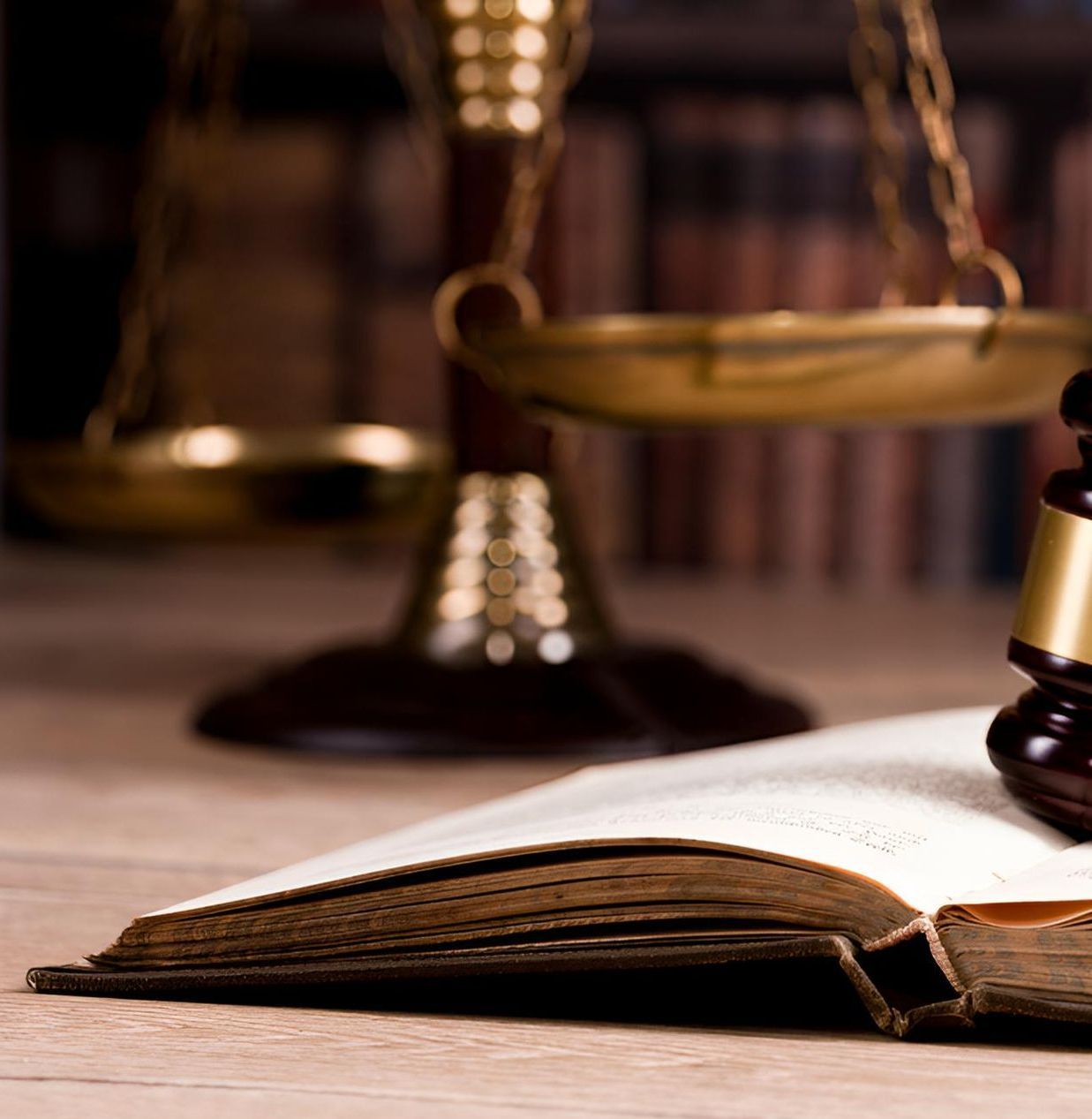 A Judge's Gavel is Sitting on Top of an Open Book — Bradley J Bragg - Solicitor in Innisfail, QLD