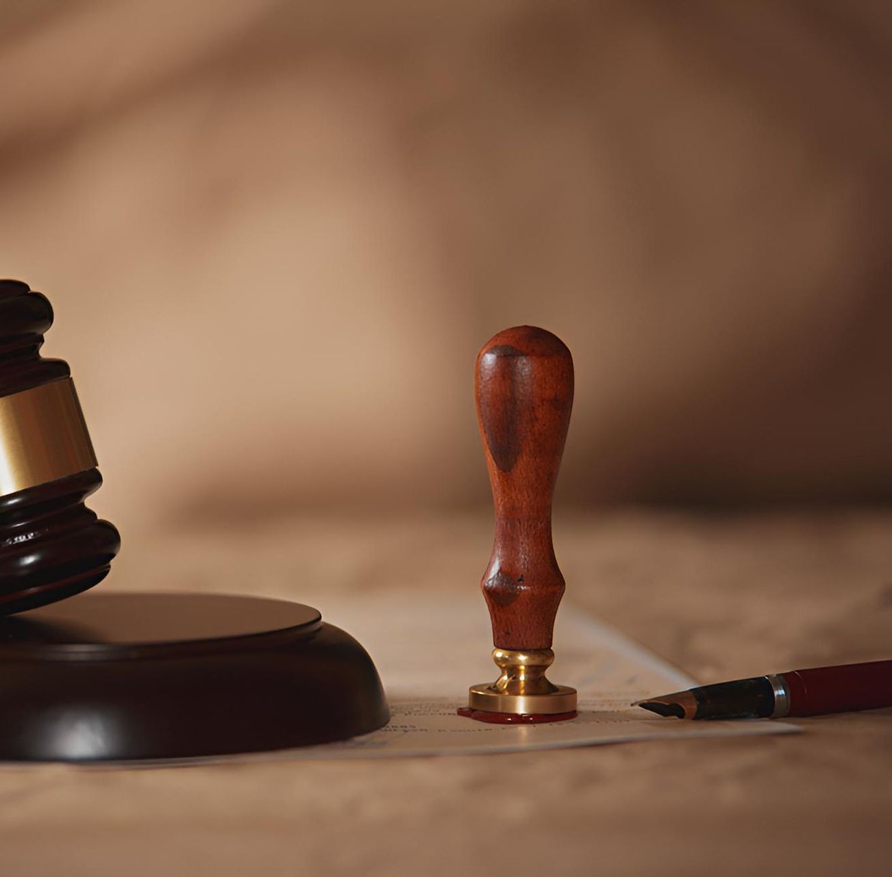 A Judge's Gavel and a Stamp Are on a Piece of Paper — Bradley J Bragg - Solicitor in Mareeba, QLD