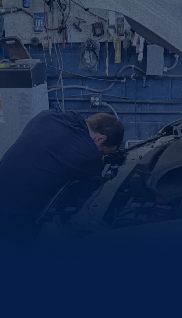 mechanic working on car engine | Neils Garage Incorporated