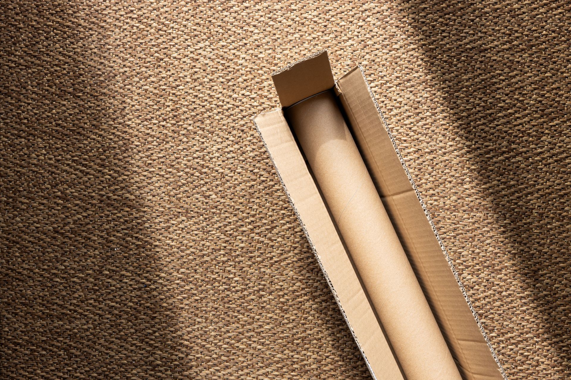 A cardboard box with a roll of paper inside of it. - Thomastown, Victoria - The Tubeworks A cardboard box with a roll of paper inside of it. - Thomastown, Victoria - The Tubeworks