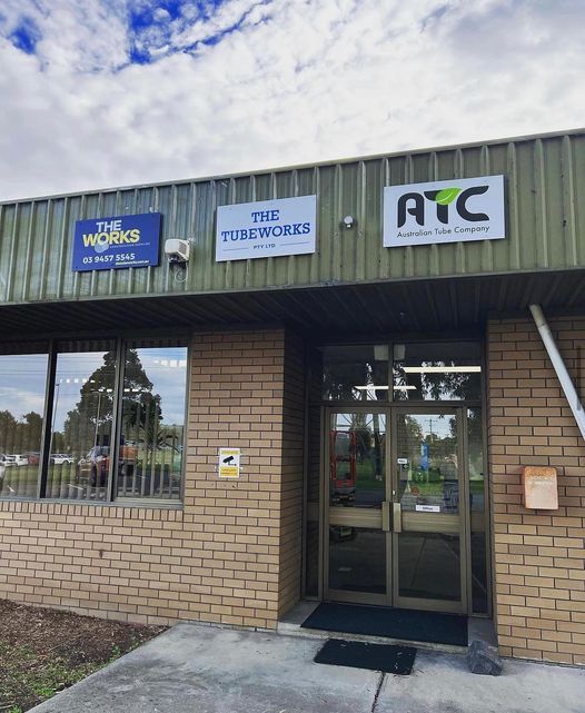 A brick building with a sign that says atc on it