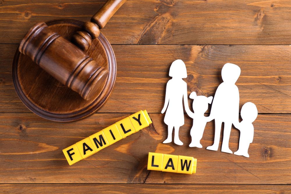 Wooden Gavel, Paper Family Cutout, and 