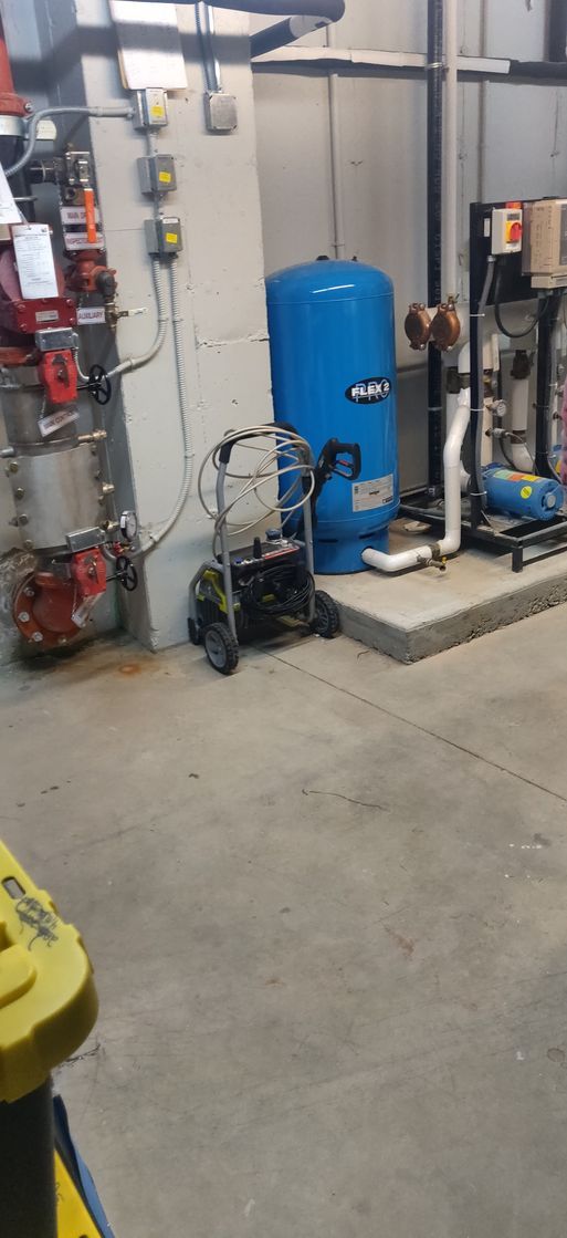 There is a blue tank in the middle of the room.