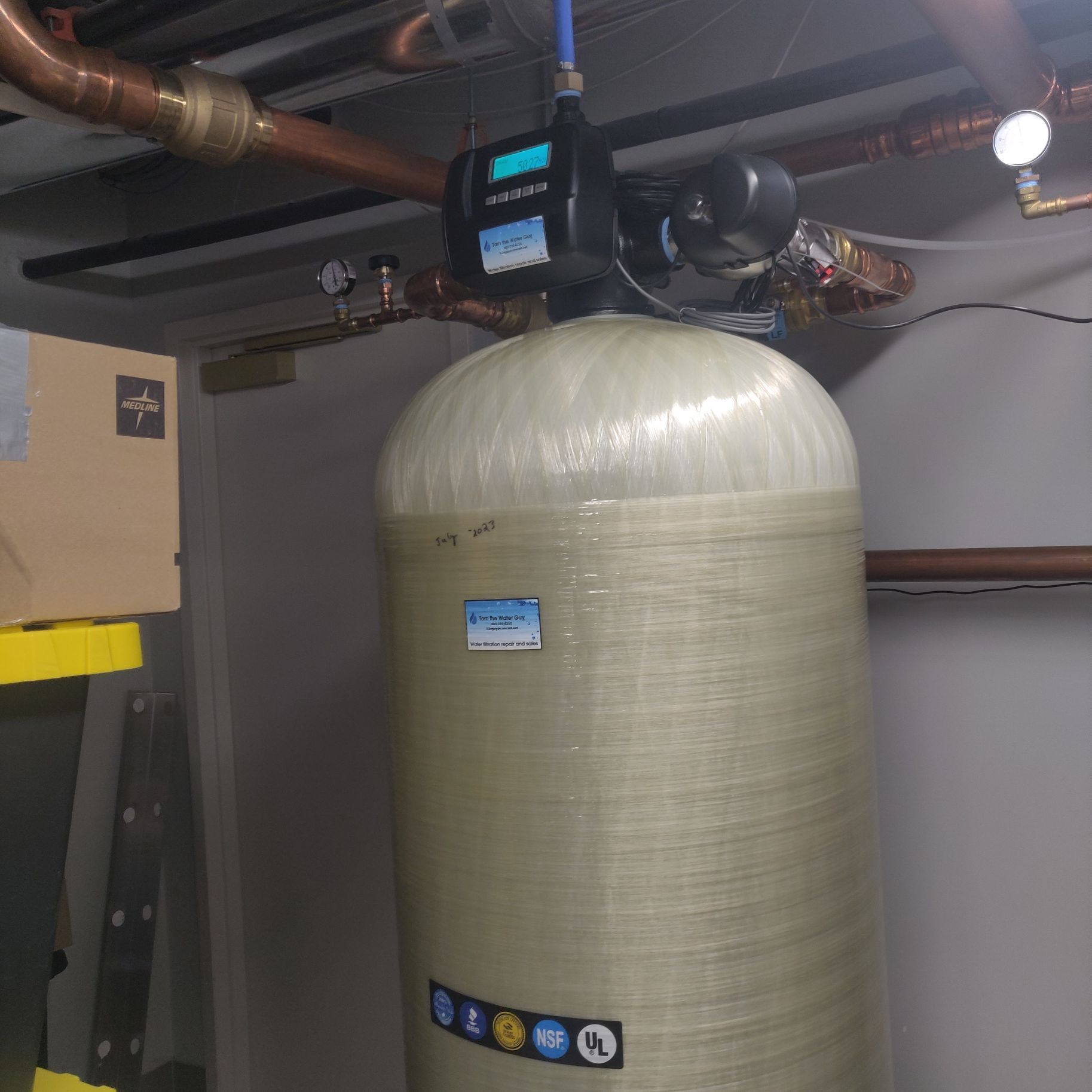 A large tank with a digital display on top of it