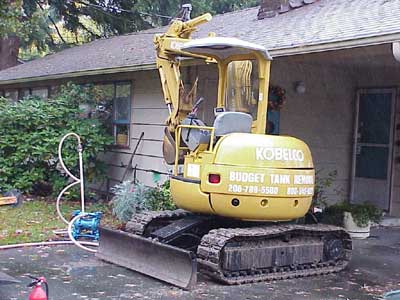 Yellow excavator - Storage tank services in Seattle WA
