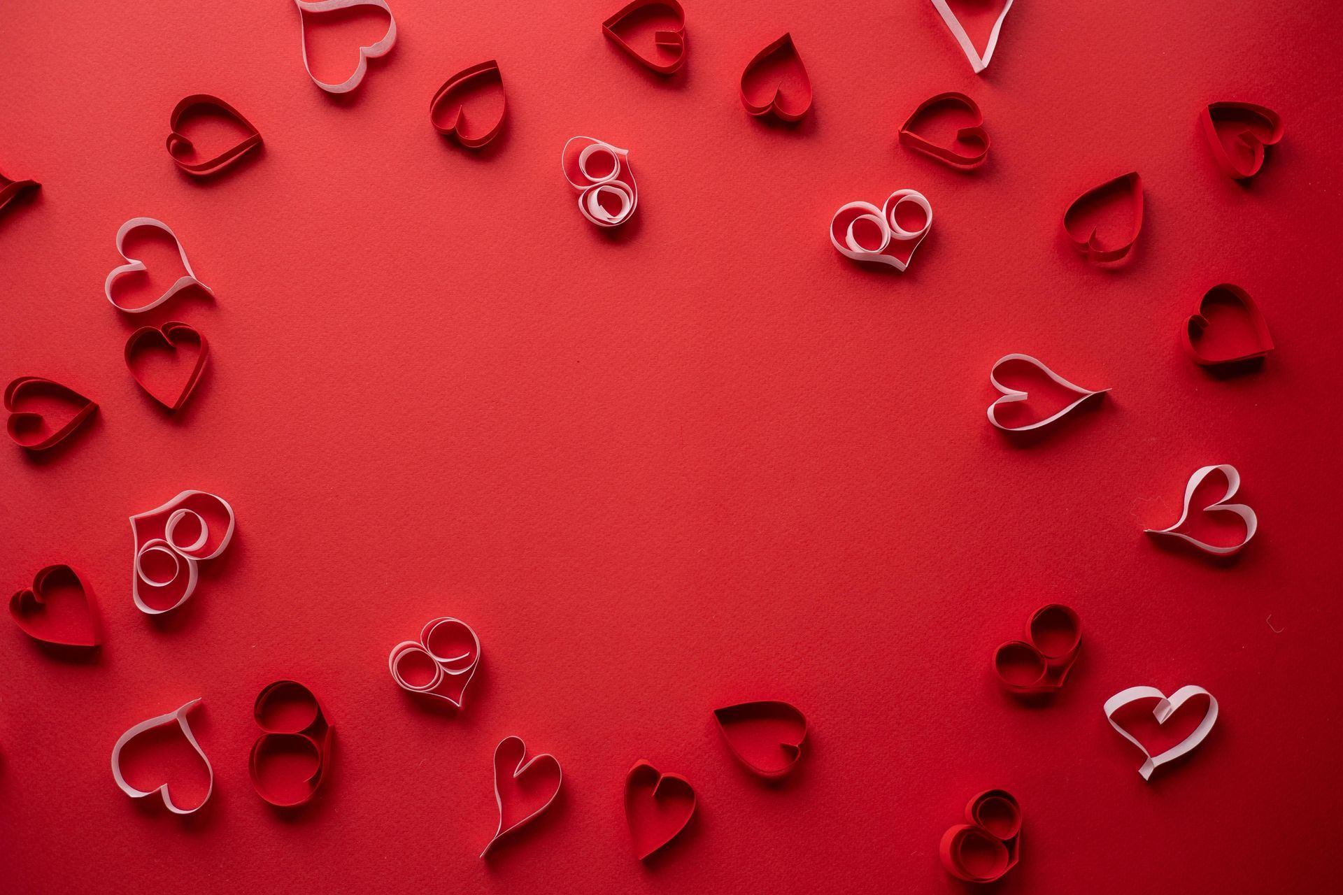 Hearts on a red background