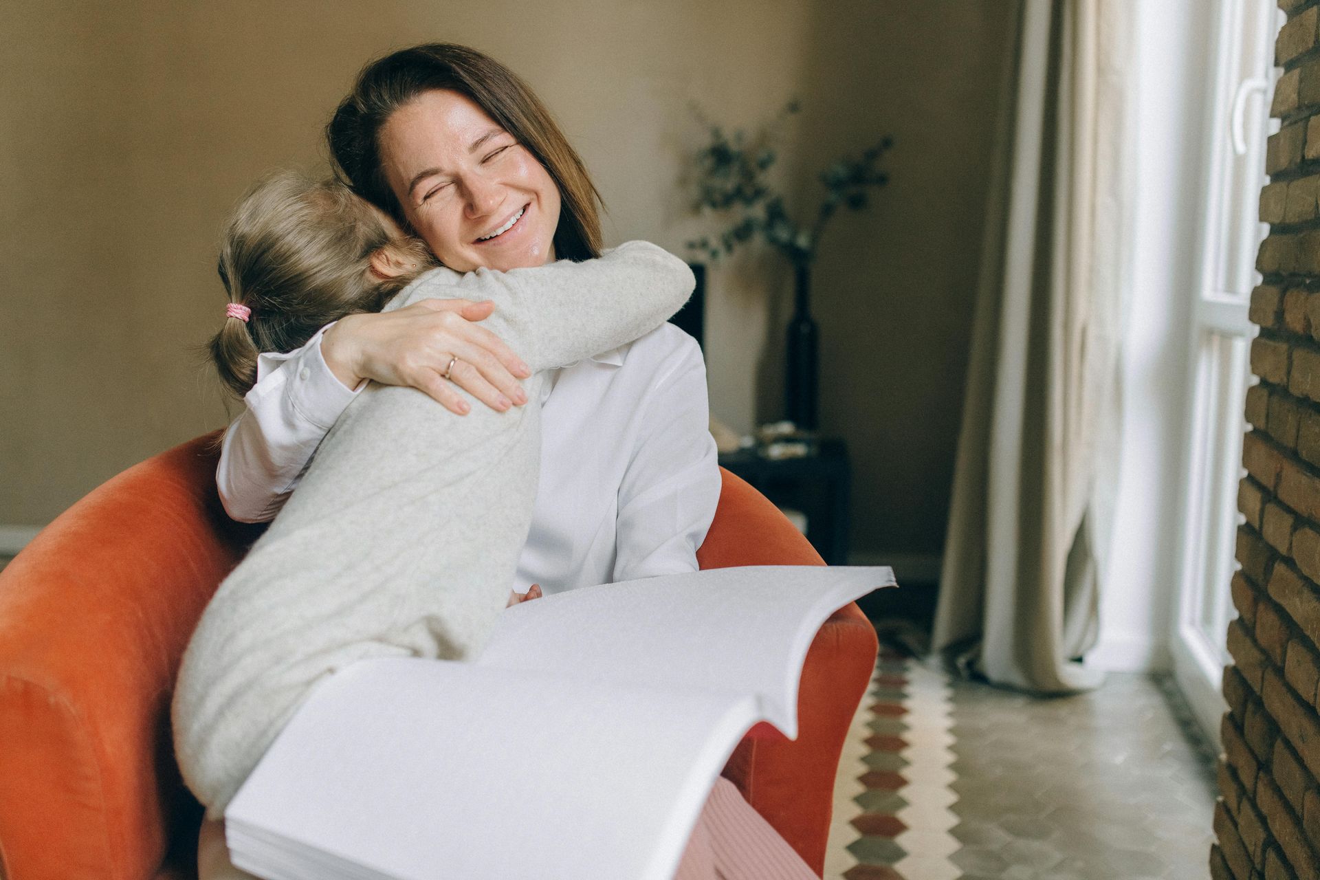 A lady showing love and support to another with a hug