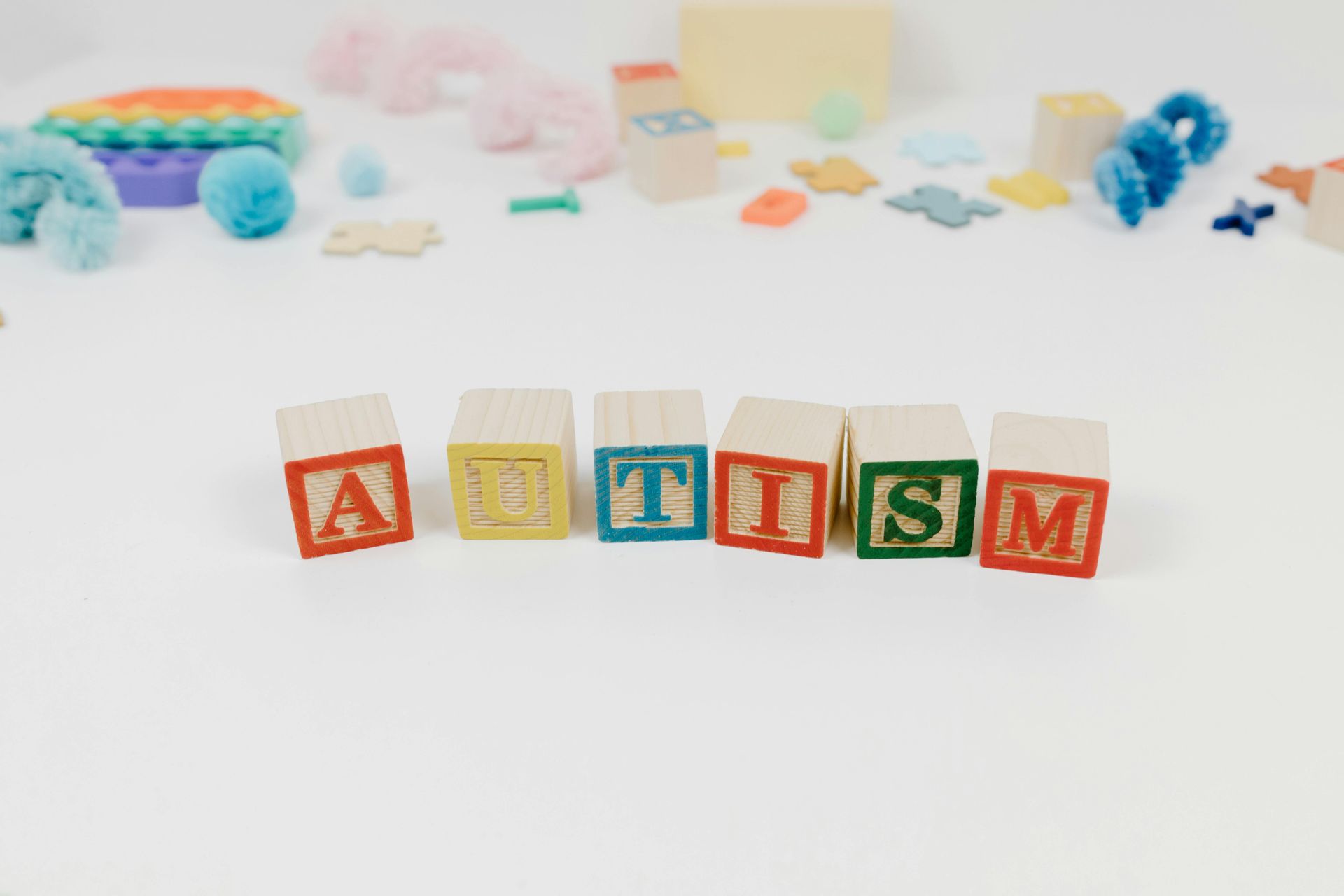 Set of blocks arranged to spell AUTISM